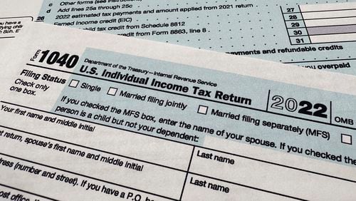 FILE - The Internal Revenue Service 1040 tax form for 2022 is seen on April 17, 2023. The IRS said Friday, April 26, 2024, more than 140,000 taxpayers filed their taxes through its new direct file pilot program. It says the program's users claimed more than $90 million in refunds, saving roughly $5.6 million in fees they would have spent with commercial tax preparation companies. (AP Photo/Jon Elswick, File)