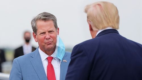Georgia Governor Brian Kemp greets President Donald Trump as he visits Georgia to talk about an infrastructure overhaul at the UPS Hapeville hub at Hartsfield-Jackson International Airport on Wednesday July 15, 2020 in Atlanta. Curtis Compton ccompton@ajc.com
