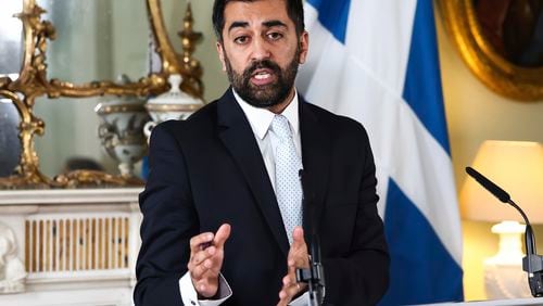 Scotland's First Minister Humza Yousaf speaks during a press conference at Bute House, Edinburgh, Thursday, April 25, 2024. Scotland’s leader is facing a potential battle for survival after ending a three-year power-sharing agreement with the Scottish Green Party following a clash over climate change policies. First Minister Humza Yousaf of the Scottish National Party informed the leaders of the much smaller Greens on Thursday that he was terminating the power-sharing agreement. (Jeff J Mitchell/PA via AP)