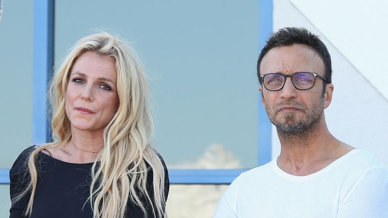 Britney Spears (L) and her longtime manager Larry Rudolph pictured in 2017. Rudolph told TMZ Spears isn't interested in performing compared to last year.
