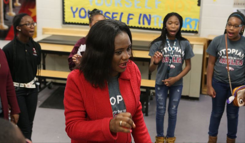 Tonia Jackson (center) directs her afternoon drama class during warmups at Utopian Academy for the Arts in Riverdale. Jackson, who co-stars in the popular Oprah Winfrey television series “Greenleaf,” says theater saved her life and she hopes her efforts at the charter school will have the same impact on students there. HENRY TAYLOR / HENRY.TAYLOR@AJC.COM