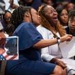 Meka Fortson (center), mother of Senior Airman Roger Fortson, grieves during her son’s funeral at New Birth Missionary Baptist Church in Stonecrest.