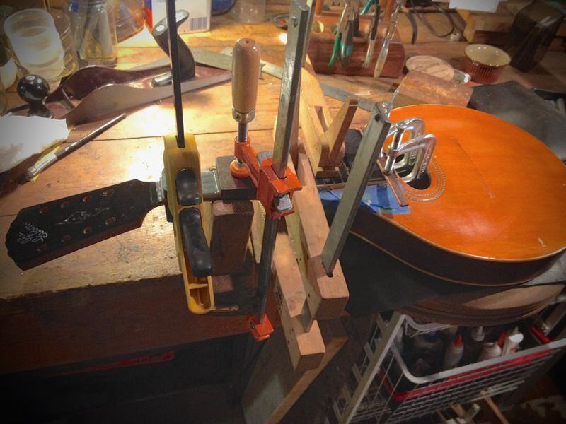 Jack Brantley and his colleague, the late Wade Lowe, worked to put the original headstock back on the old Gibson mandolin. Photo: Jack Brantley