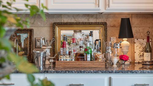 A beautifully styled bar is always at the ready in the kitchen, so guests can help themselves. (Bob Greenspan/TNS)