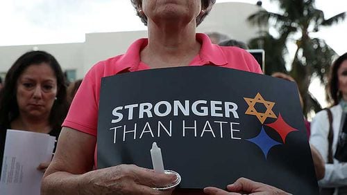 A person holds a sign that reads, 'Stronger than Hate,' as she joins with others for a Community-Wide Solidarity Vigil at the Holocaust Memorial Miami Beach to remember the victims of the mass shooting at a Pittsburgh temple on October 30, 2018 in Miami Beach, Florida. Eleven people were killed in an attack at the Tree of Life Congregation in PittsburghÕs Squirrel Hill neighborhood on Oct. 27. (Photo by Joe Raedle/Getty Images)