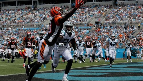 CHARLOTTE, NC - SEPTEMBER 23:  A.J. Green #18 of the Cincinnati Bengals attempts a catch against James Bradberry #24 of the Carolina Panthers in the first quarter during their game at Bank of America Stadium on September 23, 2018 in Charlotte, North Carolina.  (Photo by Streeter Lecka/Getty Images)