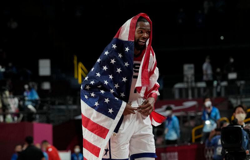 United States' Kevin Durant (7) celebrates after their win in the men's basketball gold medal game against France at the 2020 Summer Olympics, Saturday, Aug. 7, 2021, in Saitama, Japan. (AP Photo/Eric Gay)