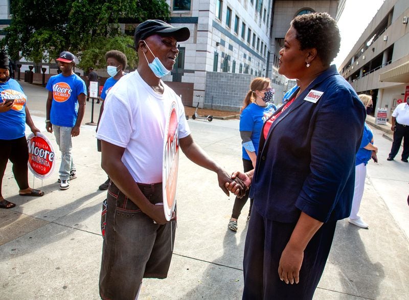  City Council President and mayoral candidate Felicia Moore talks with supporters after a press conference in Atlanta Friday, October 1, 2021.  STEVE SCHAEFER FOR THE ATLANTA JOURNAL-CONSTITUTION