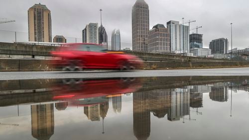 If you have to drive in heavy rain, slow down and allow yourself extra time, Atlanta police agencies suggest. Hazard lights aren't necessary unless in an emergency.