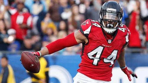 Vic Beasley Jr. heads toward the end zone with a fumble recovery TD in Sunday's 42-14 victory over the Rams. (Josh Lefkowitz/Getty Images)