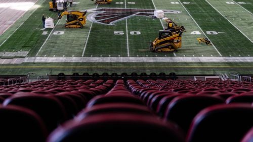 Work began Thursday on removing the artificial turf at Mercedes-Benz Stadium. A new turf will be installed over the next two weeks. (Photo by Dakota Williams/AMB Sports & Entertainment)