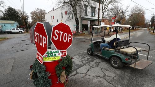 A local resident navigates the 4-way stop on East Main Street in historic downtown Rutledge on his way to the Caboose on Wednesday, Dec 8, 2021. Ed Hogan, owner of the Caboose restaurant, is opposed to a Rivian electric vehicle plant, saying "it's going to be too many vehicles. There will be 200 cars out here. I don't know what other people want but we like it the way it is."    “Curtis Compton / Curtis.Compton@ajc.com”`
