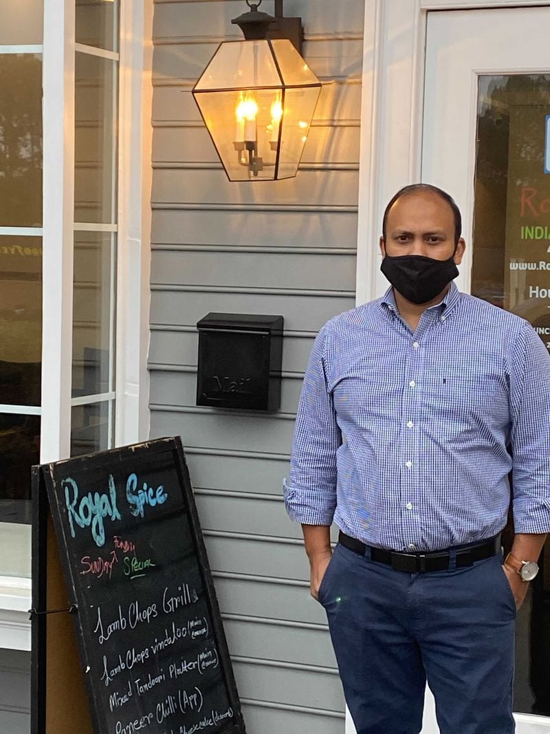 Royal Spice Indian Restaurant is owned by Junayed Ahmed (pictured) and chef Taj Ahmed. Although unrelated, they grew up in the same village in Bangladesh. Ligaya Figueras/ligaya.figueras@ajc.com
