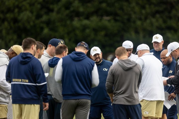 The coaching staff huddles during the first day of spring practice for Georgia Tech football at Alexander Rose Bowl Field in Atlanta, GA., on Thursday, February 24, 2022. (Photo Jenn Finch)