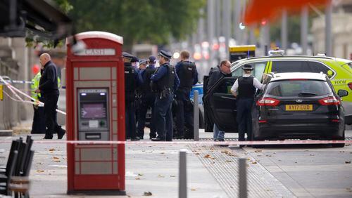 British police investigate the scene of an incident in central London on Saturday.