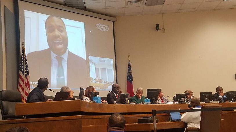 Odie Donald II, on screen, interviews for the job of South Fulton city manager over Skype in a public meeting Tuesday. ARIELLE KASS / AKASS@AJC.COM