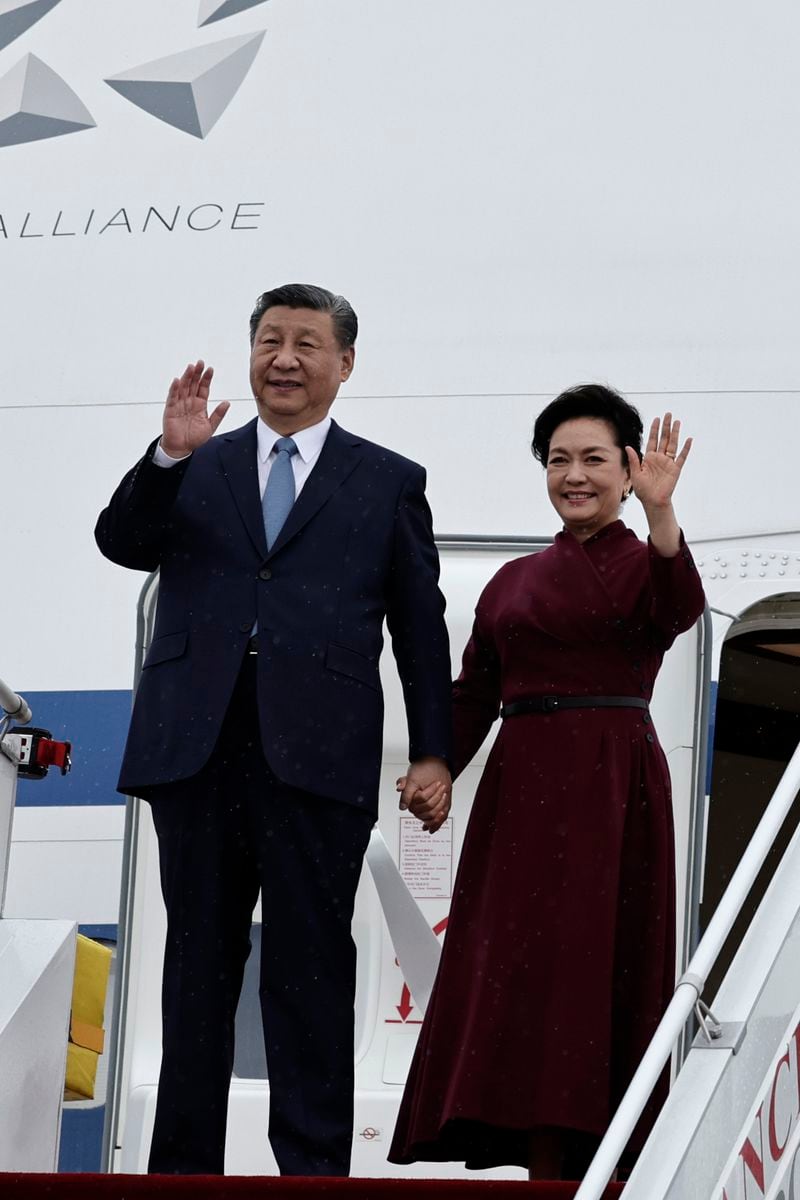 Chinese President Xi Jinping and his wife Peng Liyuan wave as they arrive at Orly airport, south of Paris, Sunday, May 5, 2024. Chinese President Xi Jinping kicked off a three-country trip to Europe on Sunday with the continent divided over how to deal with Beijing's growing power and the U.S.-China rivalry. (Stephane de Sakutin, Pool via AP)