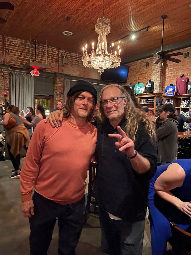 Actor Norman Reedus (left) and producer Greg Nicotero are seen at Nic & Norman's restaurant in Senoia, which they partly own, after the final day of shooting on "The Walking Dead" in March. Courtesy of Scott Tigchelaar