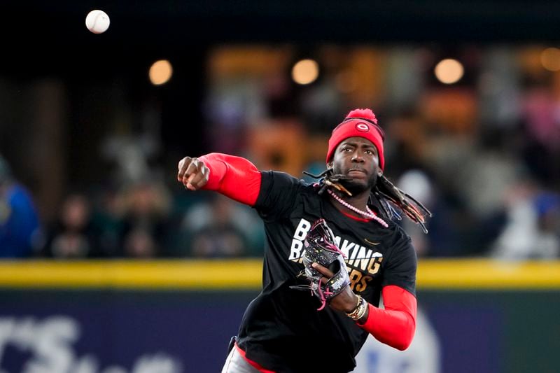 Cincinnati Reds shortstop Elly De La Cruz wears a shirt for Jackie Robinson Day during batting practice before a baseball game against the Seattle Mariners, Monday, April 15, 2024, in Seattle. (AP Photo/Lindsey Wasson)