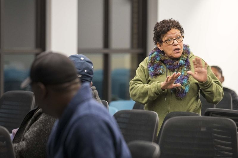 Rosario Hernandez (right) expresses her dissatisfaction with the process of the lead extraction in her yard by the United States Environmental Protection Agency during an investigation and clean up public meeting at the YMCA of Metro Atlanta in Atlanta’s Vine City neighborhood on January 23, 2020. Hernandez says she wasn’t aware of the process and is upset that the trees that used to line her yard were taken away. ALYSSA POINTER / ALYSSA.POINTER@AJC.COM