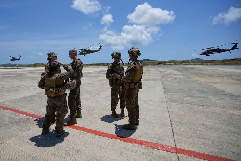 U.S. Army UH-60 helicopters take off after securing the airport at the Philippines' northernmost town of Itbayat, Batanes province during a joint military exercise on Monday, May 6, 2024. American and Filipino marines held annual combat-readiness exercises called Balikatan, Tagalog for shoulder-to-shoulder, in a show of allied battle readiness in the Philippines' northernmost island town of Itbayat along the strategic Bashi Channel off southern Taiwan. (AP Photo/Aaron Favila)