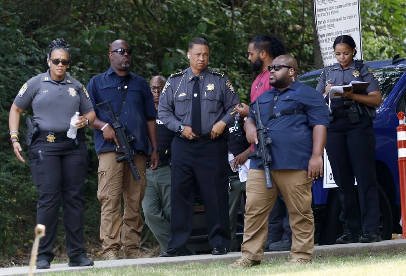 Fulton County Sheriff Patrick Labat observed the activity outside of Fulton County Jail, where media and the public packed the sidewalk for the arrival of Donald Trump on Thursday, August 24, 2023.

Miguel Martinez /miguel.martinezjimenez@ajc.com