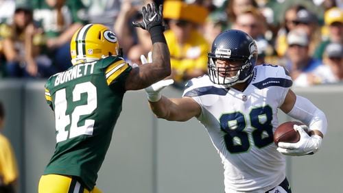 Seattle Seahawks' Jimmy Graham tries to get past Green Bay Packers' Morgan Burnett during the first half of an NFL football game Sunday, Sept. 10, 2017, in Green Bay, Wis. (AP Photo/Jeffrey Phelps)