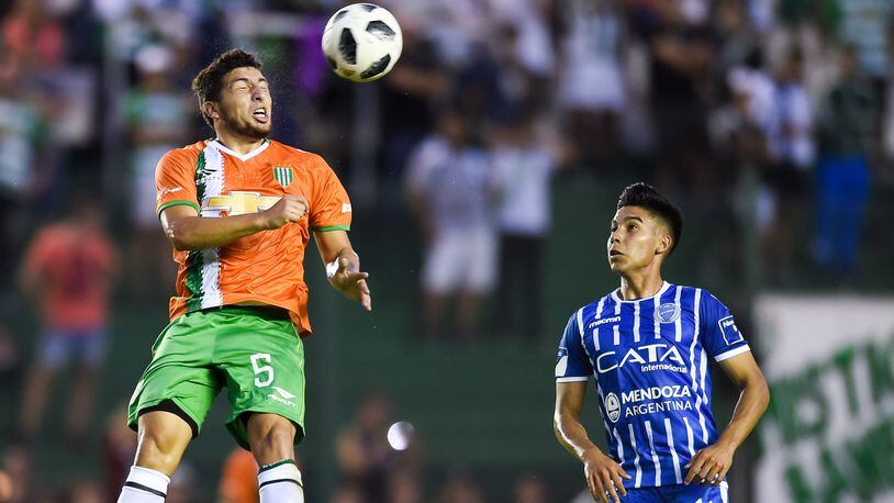 Eric Remedi of Banfield heads the ball against Guillermo FernÃ¡ndez of Godoy Cruz during a match between Banfield and Godoy Cruz as part of Argentina Superliga 2017/18 at Florencio Sola Stadium on April 21, 2018 in Buenos Aires, Argentina.