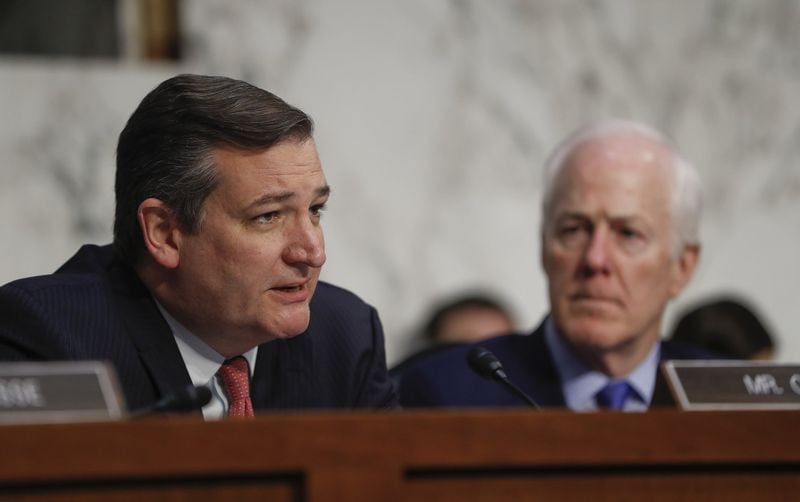 Sen. Ted Cruz, R-Texas, left, questions Yates as Sen. John Cornyn, R-Texas, right, looks on. (AP Photo/Pablo Martinez Monsivais)
