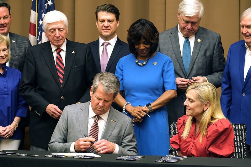 Bill Jones (far right), the father of Lt. Gov. Burt Jones, was among the state officials and local leaders photographed with Gov. Brian Kemp at a bill signing event in Athens. 