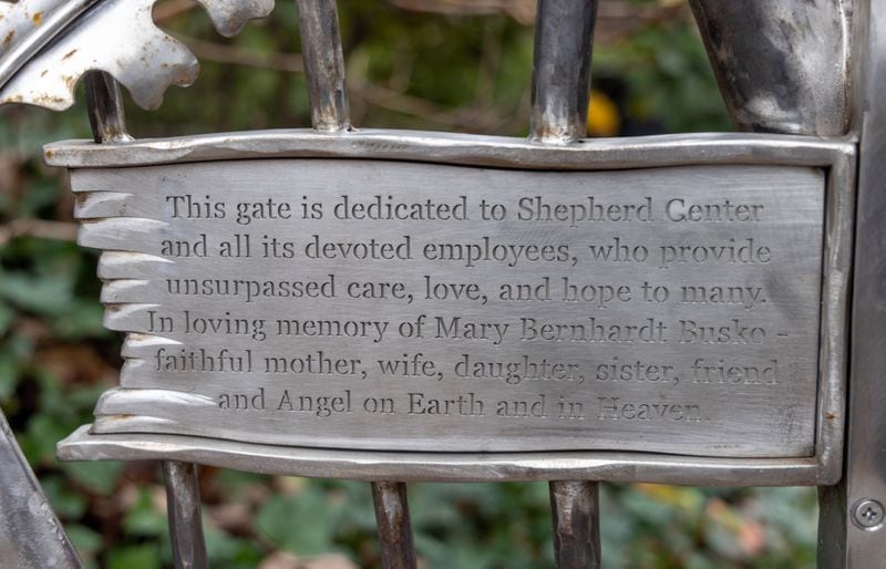 The iron gate is dedicated to Eric Busko's late wife Mary. PHIL SKINNER FOR THE ATLANTA JOURNAL-CONSTITUTION