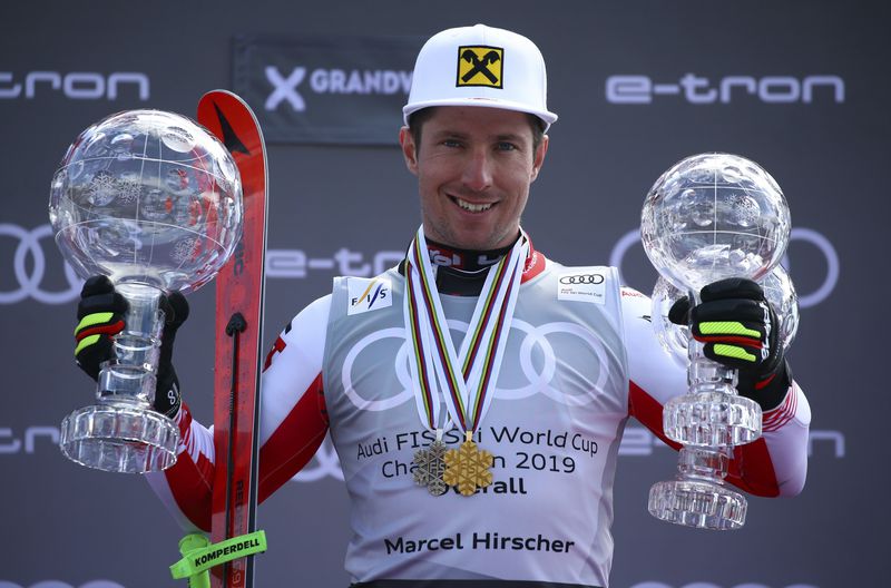 FILE - Austria's Marcel Hirscher poses on the podium with the trophies for men's alpine ski World Cup overall leader, giant slalom and slalom, in Soldeu, Andorra, on March 17, 2019. Eight-time overall World Cup champion Hirscher is planning to return to ski racing next season after five years in retirement. And he’s going to compete for the Netherlands — his mother’s country — instead of his native Austria. The Austrian winter sports federation announced Wednesday, April 24, 2024, that it had released the 35-year-old Hirscher and endorsed his nation change. (AP Photo/Alessandro Trovati, File)
