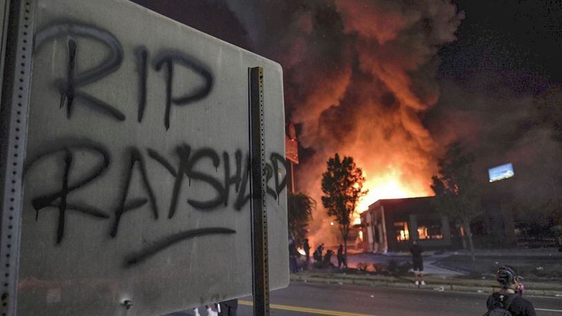 The Wendy's on University Avenue in Atlanta was in flames after demonstrators blocked the interstate and set it on fire Saturday night, June 13, 2020. Protesters gathered there after Rayshard Brooks, a 27-year-old black man, was shot and killed by Atlanta police Friday evening during a struggle at the Wendy's drive-thru line. (Ben Gray for The Atlanta Journal-Constitution)