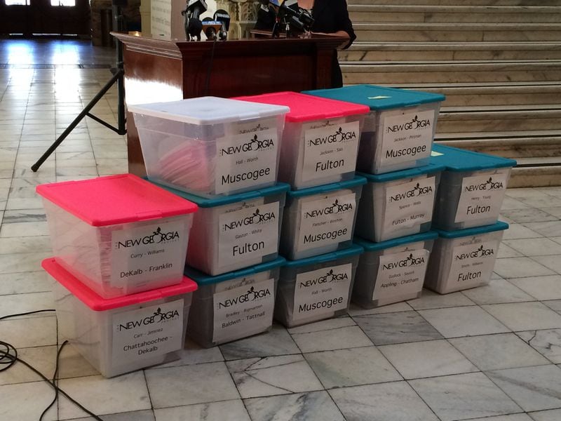 Copies of 2014 voter registration files turned over to the state by the New Georgia Project. KRISTINA TORRES / AJC FILE