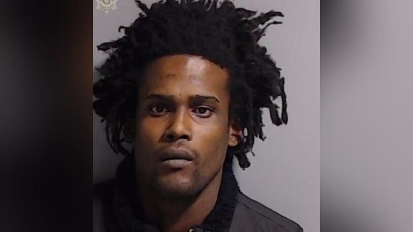 Alisteir Murray, 31, faces a charge of murder and aggravated assault in connection with a shooting that left a man dead and a woman injured, according to East Point police.