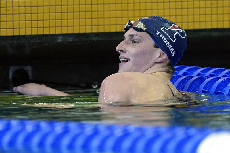 Lia Thomas, a transgender woman competing for the University of Pennsylvania, smiles after winning a preliminary heat in the 500-yard freestyle at the NCAA women's swimming and diving championships at Georgia Tech in March. (AP Photo/John Bazemore)