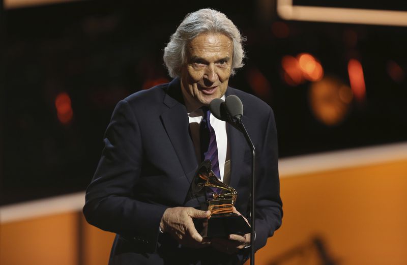 John McLaughlin accepts the best improvised jazz solo award for "Miles Beyond" at the 60th annual Grammy Awards at Madison Square Garden on Sunday, Jan. 28, 2018, in New York. (Photo by Matt Sayles/Invision/AP)