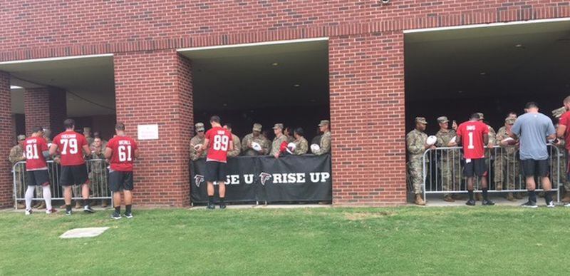  Falcons signing autographs for the soldiers from Fort Benning after practice today. (By D. Orlando Ledbetter/dledbetter@ajc.com)