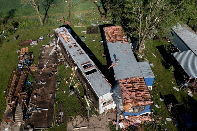 Storm damaged mobile homes are surrounded by debris at Pavilion Estates mobile home park just east of Kalamazoo, Mich. Wednesday, May 8, 2024. A tornado ripped through the area the evening of May 7. (Neil Blake/The Grand Rapids Press via AP)