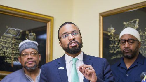 CAIR-Ga. executive director Edward A. Mitchell (center), shown during a news conference after the massacre at two mosques earlier this year in New Zealand, is warning mosques across Georgia to be vigilant.