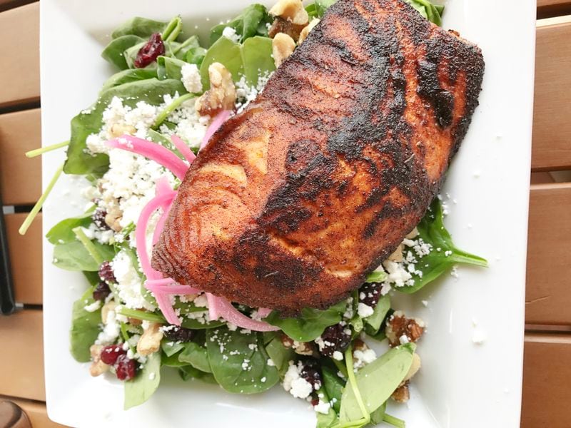  Grilled Faroe Island salmon on top of a spinach salad from Volare Bistro in Hapeville, Georgia./ Photo by Ligaya Figueras