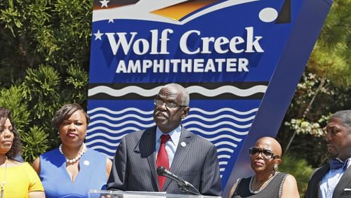In a press conference held at the entrance to Wolf Creek Amphitheater, the Mayor of South Fulton, Bill Edwards (center), along with city leaders, announced the city is suing Fulton County for control of libraries, Wolf Creek amphitheater and other buildings. Bob Andres / robert.andres@ajc.com