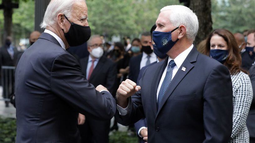 Democratic presidential candidate former Vice President Joe Biden greets Vice President Mike Pence at the 19th anniversary ceremony in observance of the Sept. 11 terrorist attacks at the National September 11 Memorial & Museum in New York, on Friday. (Amr Alfiky/The New York Times via AP, Pool)