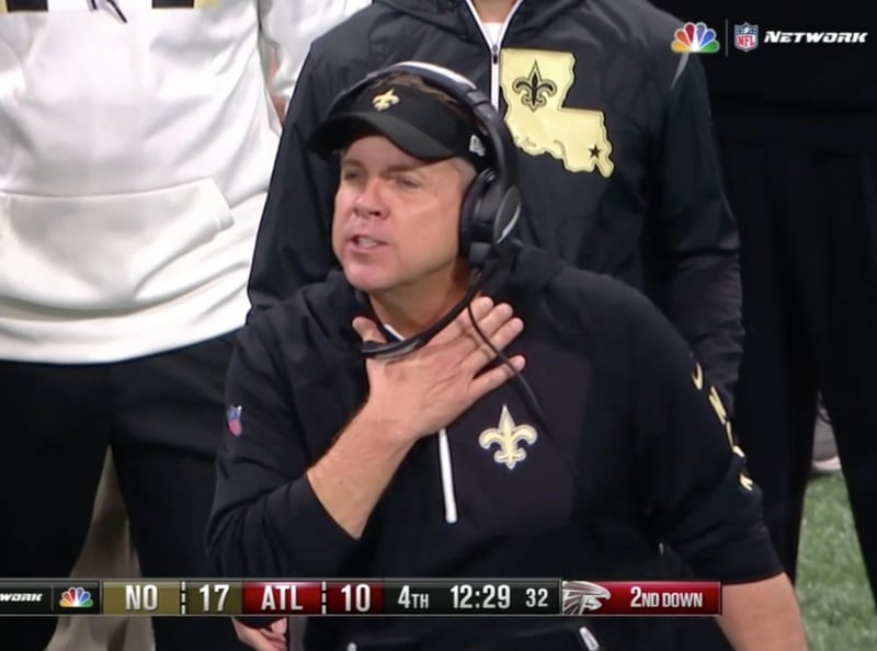 New Orleans Saints coach Sean Payton makes the "choke" sign during a game with the Atlanta Falcons.