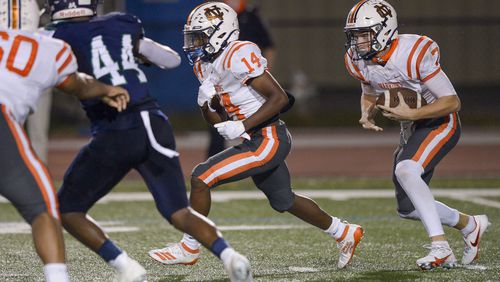 North Cobb quarterback Trevor Lovett carries the ball and gains yardage in the second half of his game at Harrison High School Friday, October 23, 2020. PHOTO/Daniel Varnado 