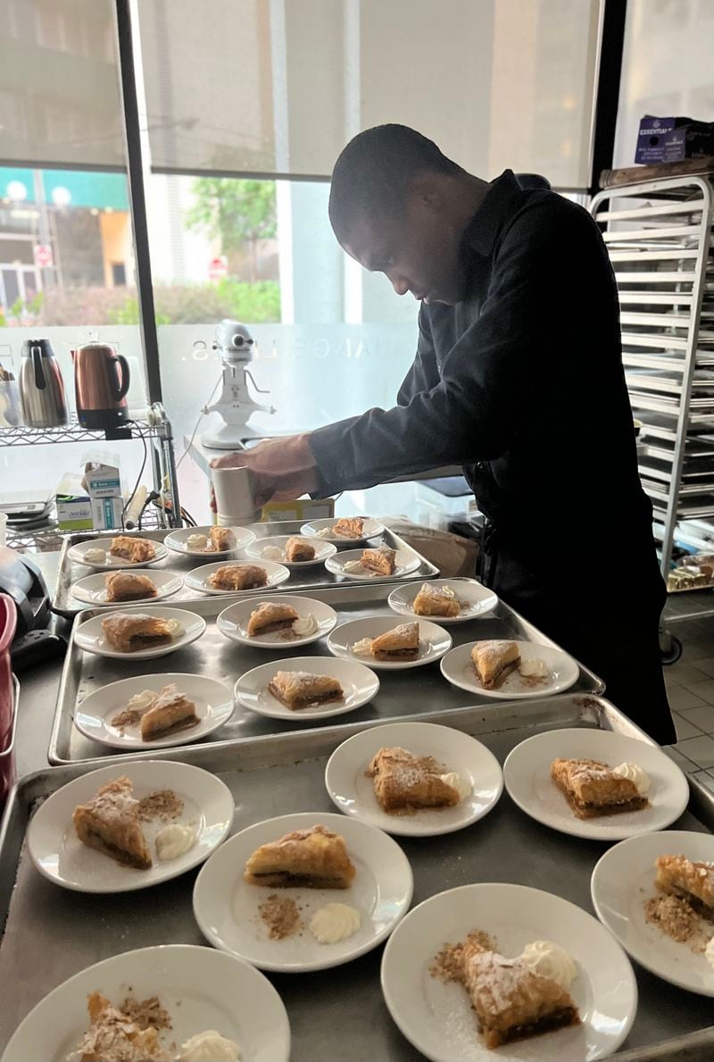 An intern prepares food at Café Momentum. Courtesy of Café Momentum