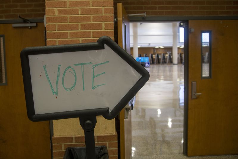 08/11/2020 - Norcross, Georgia - A sign directs voters to the cafeteria at Norcross High Schoolduring Georgia primary run-off elections in Norcross, Tuesday, August 11, 2020. (ALYSSA POINTER / ALYSSA.POINTER@AJC.COM)