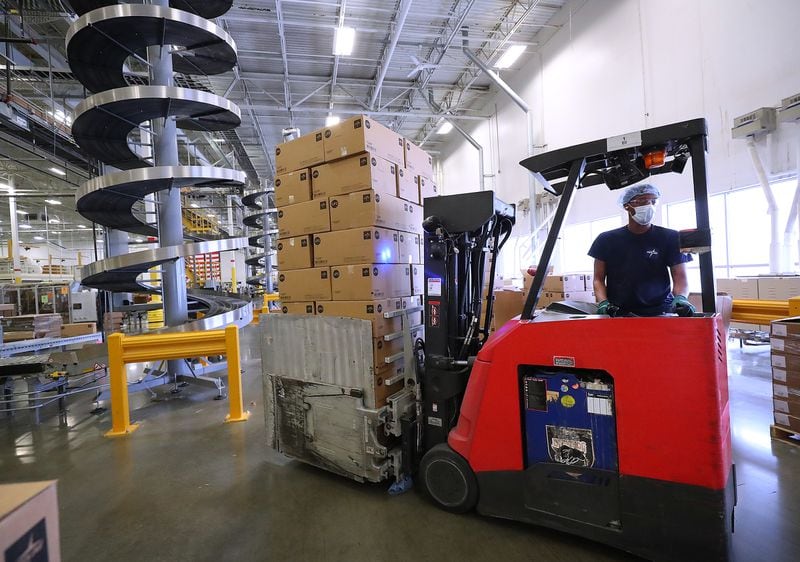A lift operator moves boxes of finished product for shipping from the end of a production line at Medline on Monday, Sept 20, 2021, in Lithia Springs.   “Curtis Compton / Curtis.Compton@ajc.com”