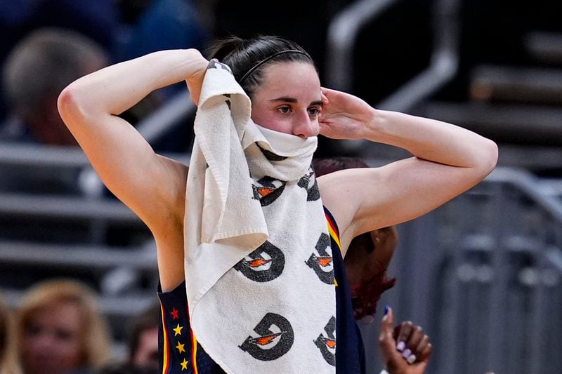 Indiana Fever guard Caitlin Clark reacts after a teammate's basket against the Atlanta Dream during the first half of a preseason WNBA basketball game in Indianapolis, Thursday, May 9, 2024. (AP Photo/Darron Cummings)