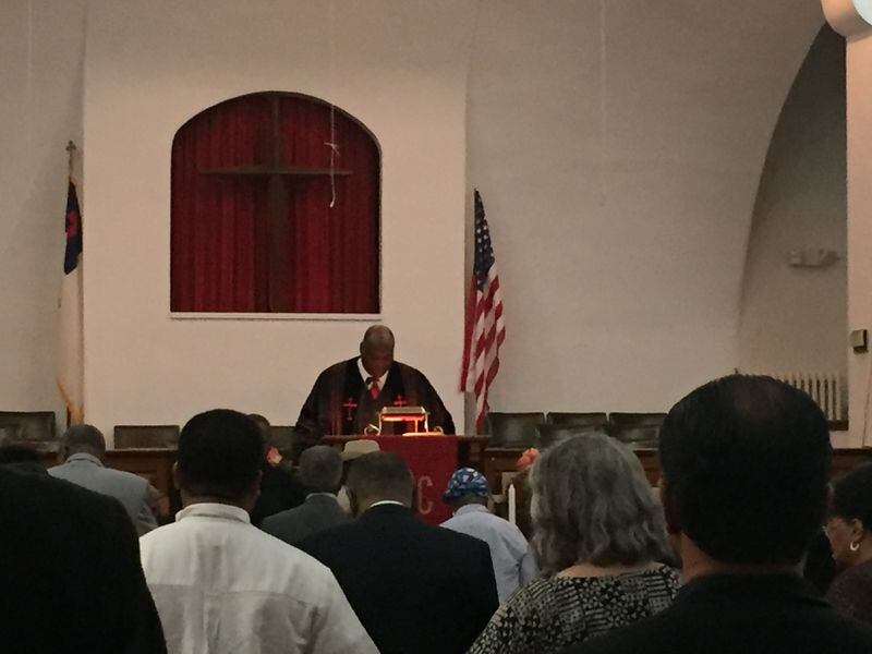 Senior Pastor Rev. Charles Gill leads a prayer at Pilgrim Baptist Church in St. Paul, Minnesota’s oldest African-American church. Photo: Willoughby Mariano